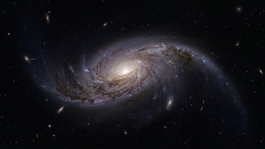 Hubble captura imagem impressionante de galáxia espiral perdendo lentamente o seu futuro