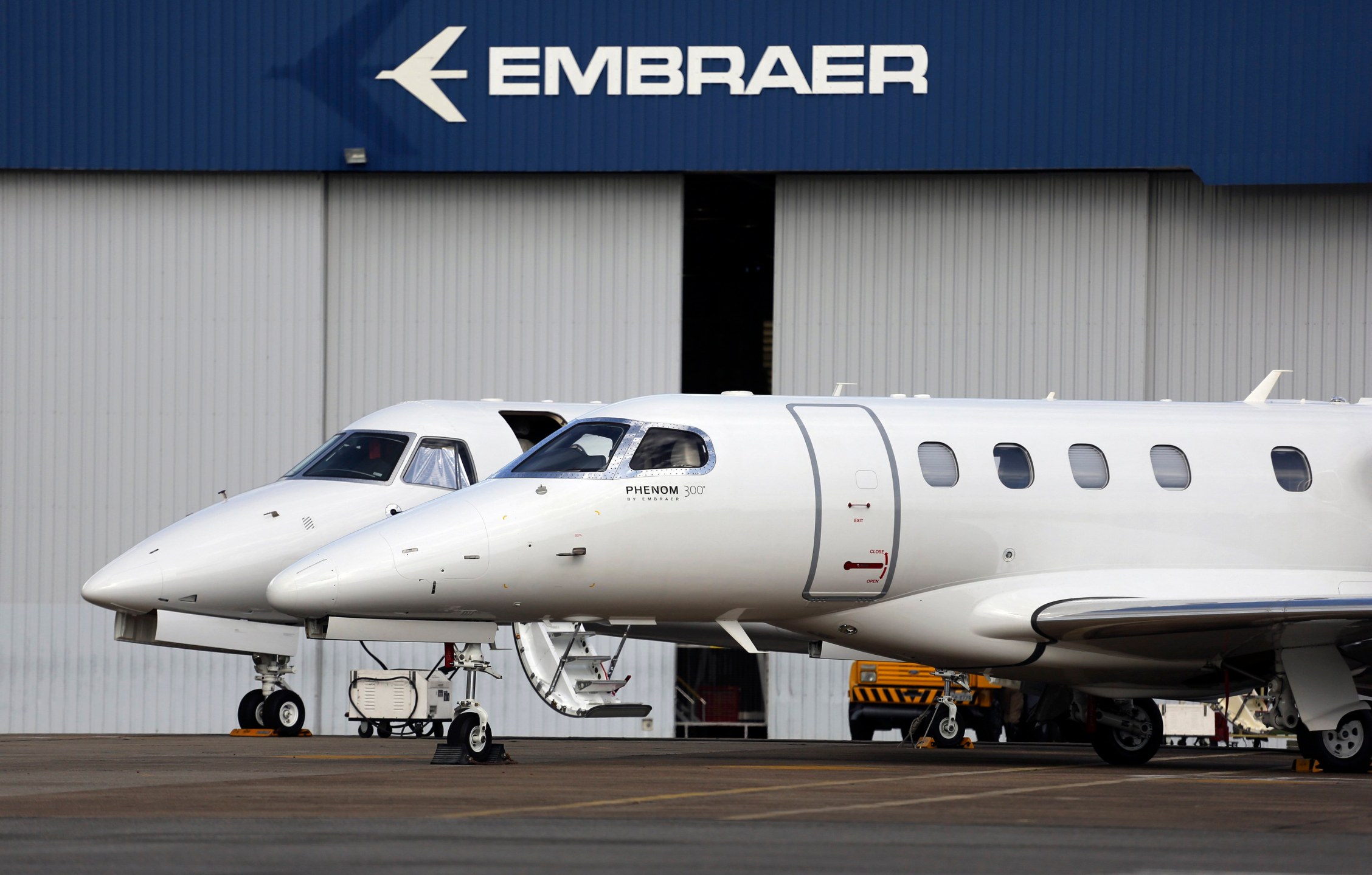 Private jets are seen at the Embraer headquarters in Sao Jose dos Campos, 100 km (62 miles) from Sao Paulo May 14, 2013. Brazil's barriers to international trade are limiting its growth potential and could hamper a huge infrastructure push at the center o