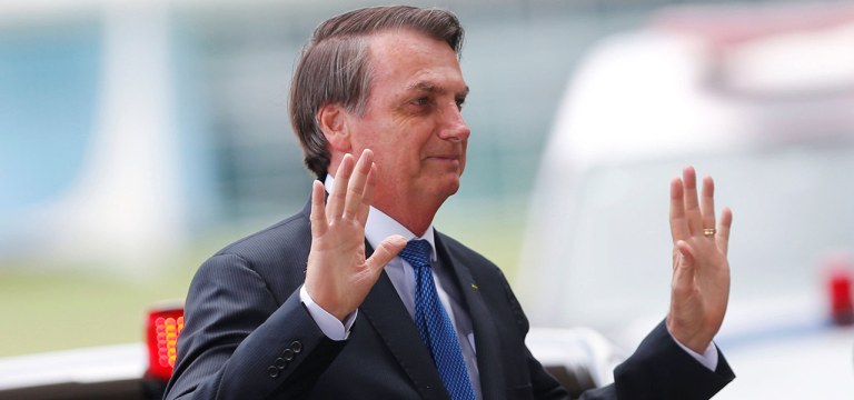 Brazil's President Jair Bolsonaro gestures as he leaves the Alvorada Palace in Brasilia, Brazil December 12, 2019. REUTERS/Adriano Machado